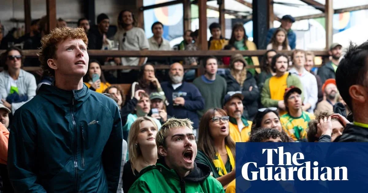 A crowd watching a sports event with intense expressions