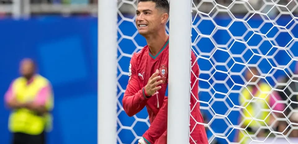 Cristiano Ronaldo gesturing near the goal post