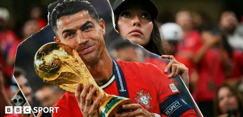 Fan holding a poster of Cristiano Ronaldo with trophy