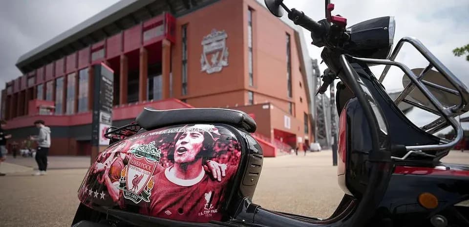 Scooter decorated with Liverpool FC logo outside Anfield
