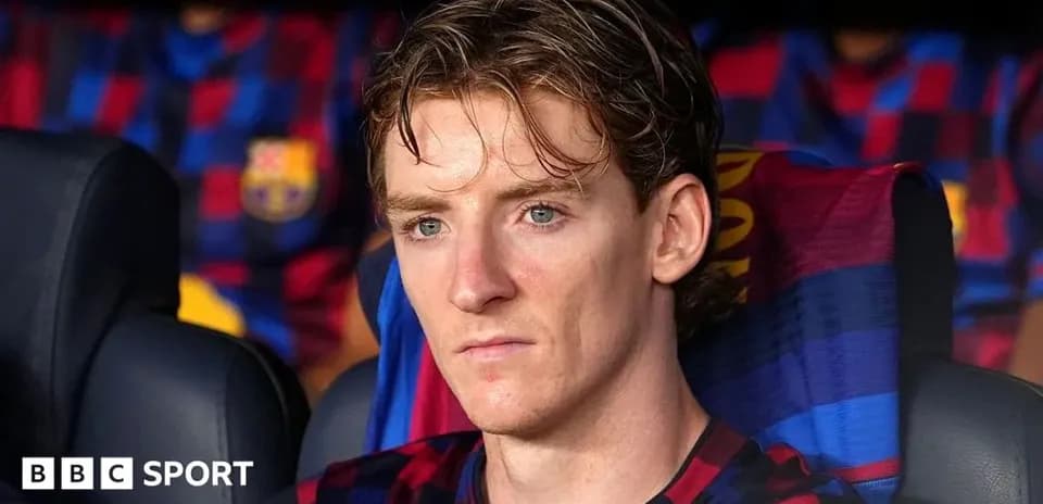 Jugador sentado en el banquillo del FC Barcelona