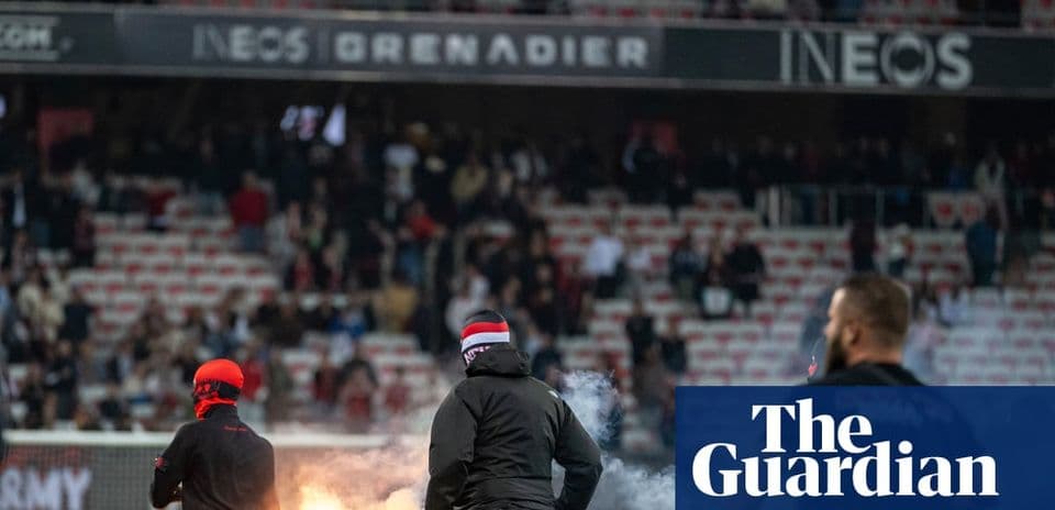 Aflare igniting in the stands during a match