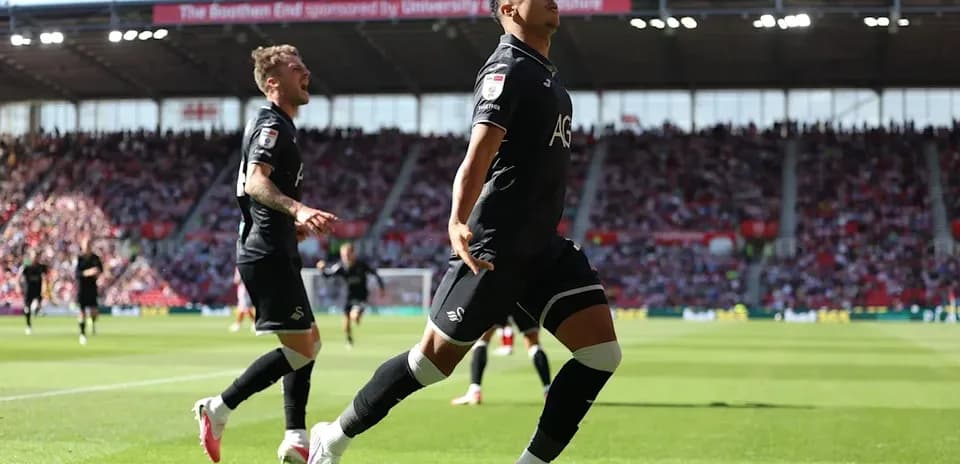 Jugador celebrando un gol en el estadio