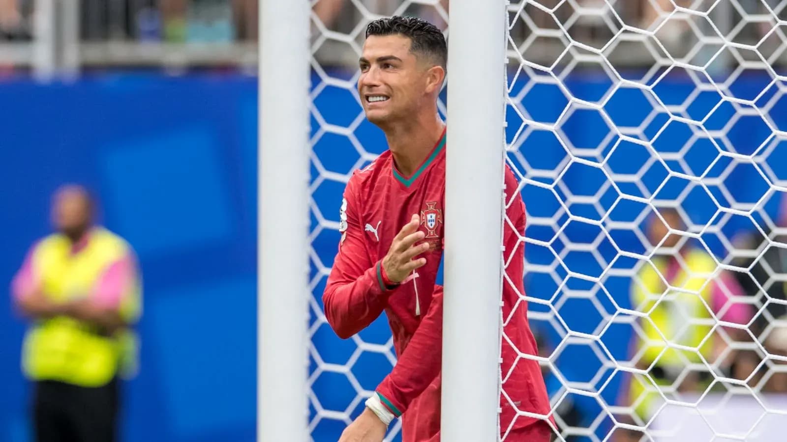 Cristiano Ronaldo gesturing near the goal post Cristiano Ronaldo gesturing near the goal post