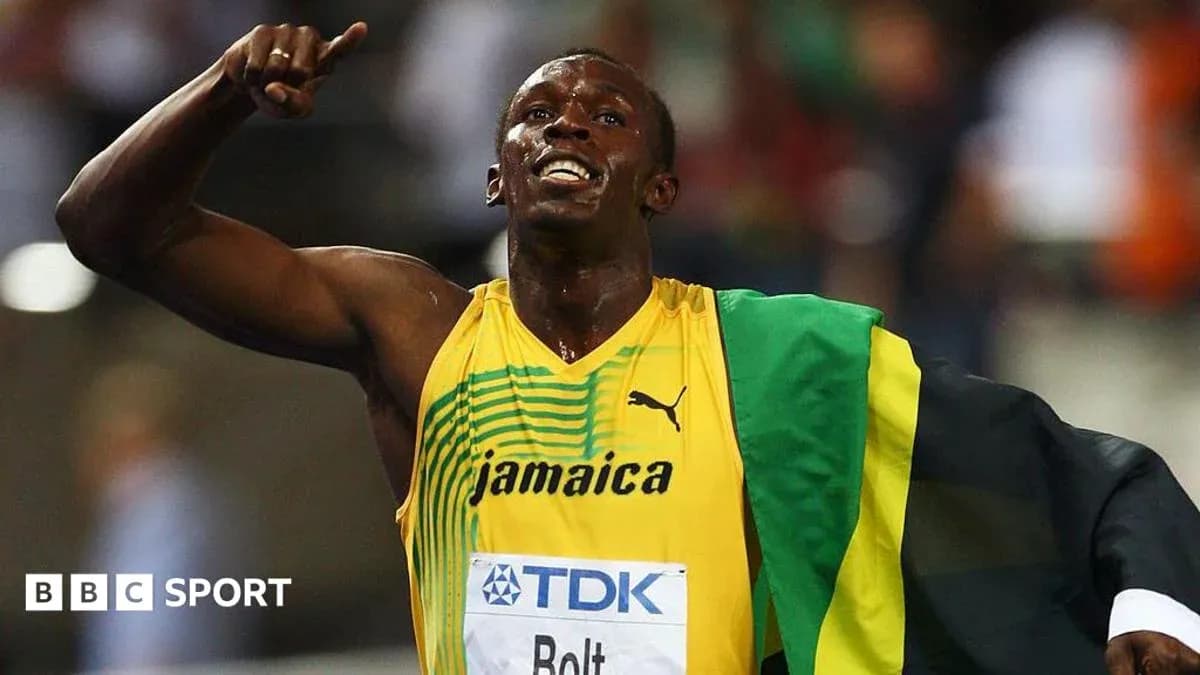 Atleta celebrando con bandera de Jamaica en carrera Atleta celebrando con bandera de Jamaica en carrera